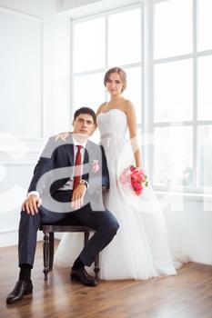 Eli Mora Photo - stockfresh_7082105_bride-and-groom-in-very-bright-room_sizeL_7a9dca.jpg